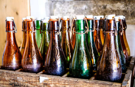 old bottles in wooden boxesの写真素材
