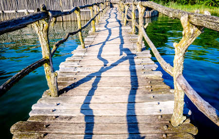 old bridge at a lakeの写真素材