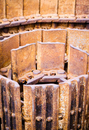 rolled up rusty tank trackの写真素材