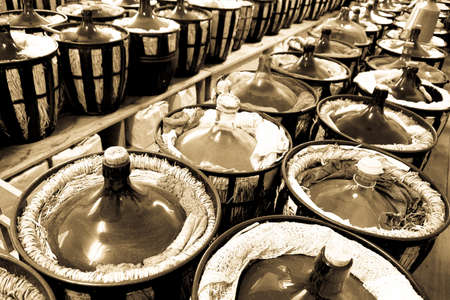 old wine bottles at a cellarの写真素材