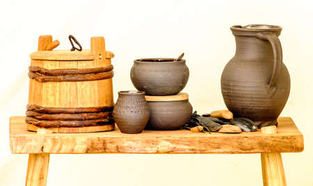 old pots on a chairの写真素材