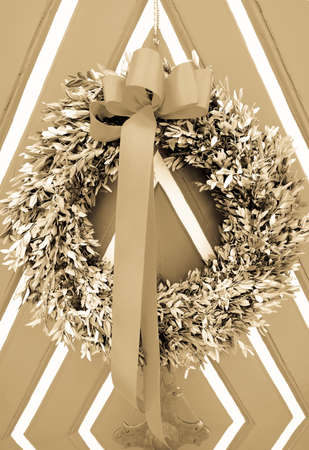 old wreath at a doorの写真素材