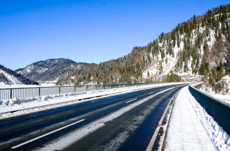 country road at the sylvenstein lake - bavariaの写真素材