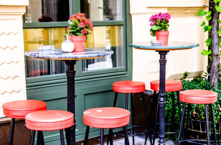 table and chairs at a sidewalk cafeの写真素材