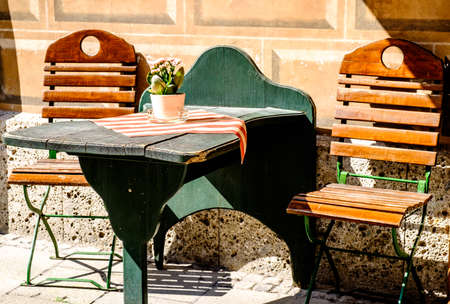 table and chairs at a sidewalk cafe