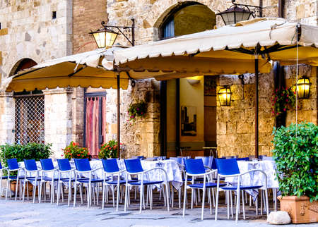 typical sidewalk restaurant in italyの写真素材