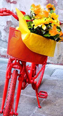 old bike with flowers in italyの写真素材