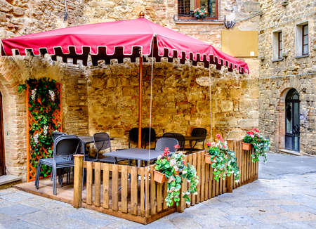 typical sidewalk restaurant in italyの写真素材