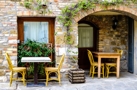typical sidewalk restaurant in italyの写真素材