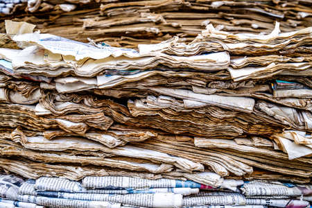 tower of old weathered newspapersの写真素材