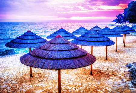 typical beach umbrellas in croatiaの写真素材