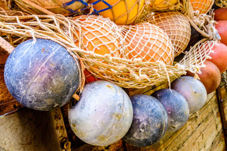 buoys and fishing nets at a harborの写真素材