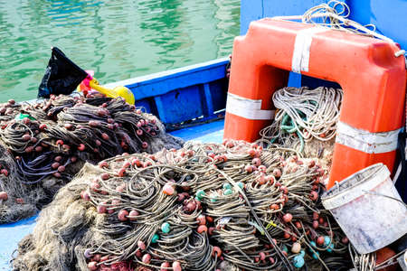buoys and fishing nets at a harborの写真素材