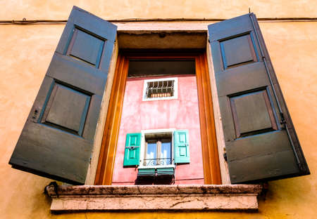 old window in italy - nice reflectionの写真素材