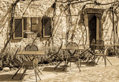 typical sidewalk restaurant in italyの写真素材