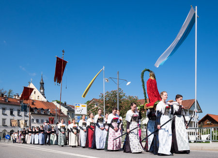 BAD TOELZ, GERMANY - MAY 26 - People in traditional costumes at the Corpus Christi procession at May 26, 2016 in Bad Toelz - Germany.のeditorial素材