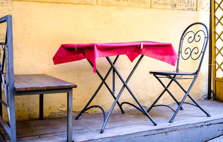 typical sidewalk restaurant in italyの写真素材