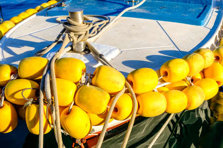 yeoow buoys at a fishing boatの写真素材