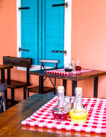table and chairs at a sidewalk restaurant in croatiaの写真素材