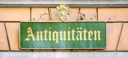 old sign for an antique shop in germanの写真素材