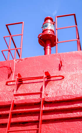 old beacon at a harbor in croatiaの写真素材