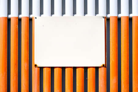 blank sign at a fence - nice background for textの写真素材