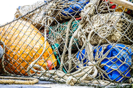 buoys and fishing nets at a harborの写真素材