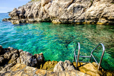 ladder at a beach in croatiaの写真素材
