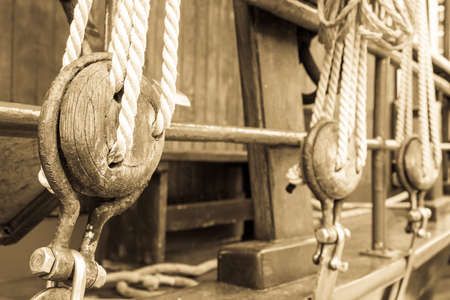 old wooden pulley at a boatの写真素材