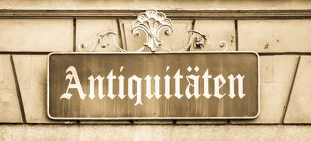 old sign for an antique shop in germanの写真素材