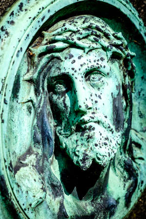 old jesus christ relief at a historic gravestoneの写真素材