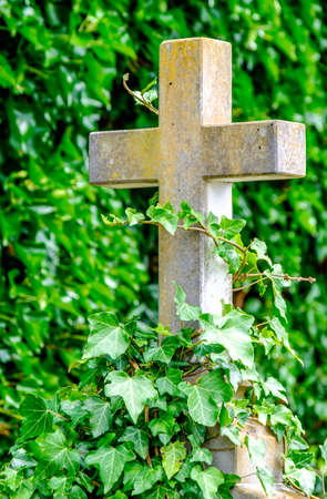 old cross at a cemeteryの写真素材