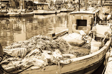old fishing boat at a harborの写真素材