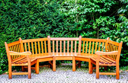 round parkbench at a sidewalkの写真素材