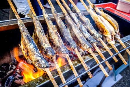 typical bavarian fish on a stick at the oktoberfest - germanyの写真素材