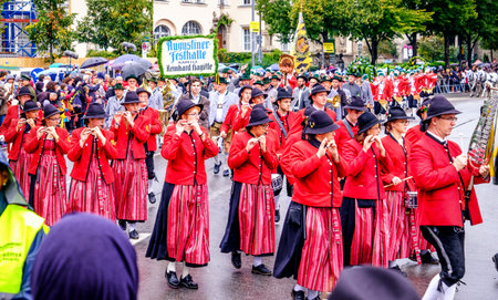 MUNICH, GERMANY - SEPTEMBER 16, 2017: The Oktoberfest is the world biggest beer festival and at the opening parade with rd. 9000 participants take part in historical costumes, music bands and horses.のeditorial素材