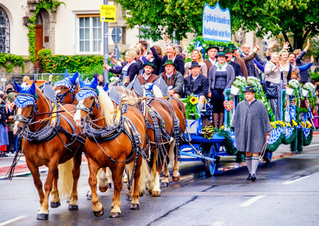 MUNICH, GERMANY - SEPTEMBER 16, 2017: The Oktoberfest is the world biggest beer festival and at the opening parade with rd. 9000 participants take part in historical costumes, music bands and horses.のeditorial素材