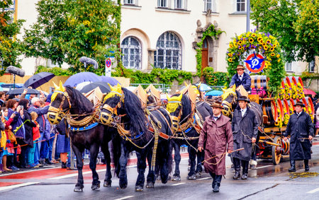 MUNICH, GERMANY - SEPTEMBER 16, 2017: The Oktoberfest is the world biggest beer festival and at the opening parade with rd. 9000 participants take part in historical costumes, music bands and horses.のeditorial素材