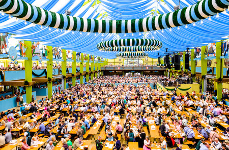 MUNICH, GERMANY - SEPTEMBER 28: people in the "Spaten"-beer tent at the biggest folk festival in the world - the octoberfest on september 28, 2017 in munich.のeditorial素材