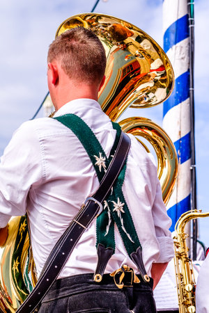 MUNICH, GERMANY - SEPTEMBER 27: brass band musicans at the biggest folk festival in the world - the octoberfest on september 27, 2017 in munich.のeditorial素材