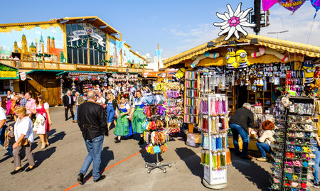 MUNICH, GERMANY - SEPTEMBER 26: people and fairground rides at the biggest folk festival in the world - the octoberfest on september 26, 2017 in munich.のeditorial素材