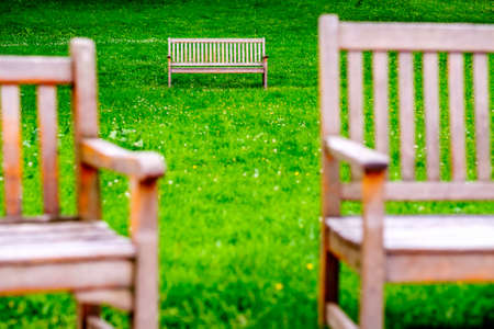 wooden parkbench at a parkの写真素材