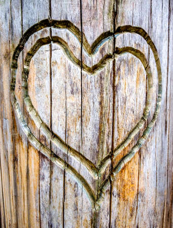old wooden heart - closeup photoの写真素材