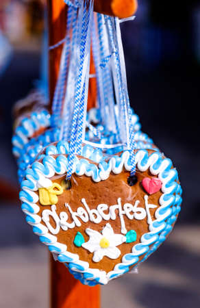 typical souvenir at the oktoberfest in munich - a gingerbread heart - lebkuchenherzの写真素材