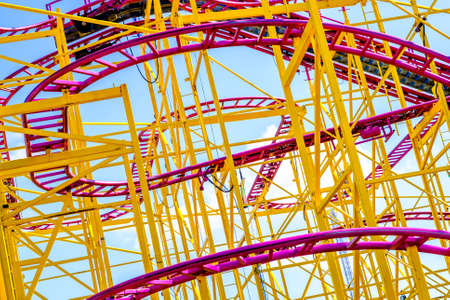 part of a roller coaster in front of blue skyの写真素材