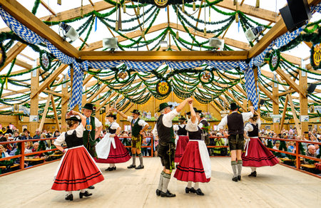 MUNICH, GERMANY - SEPTEMBER 21: people in the "traditon"-beer tent at the biggest folk festival in the world - the octoberfest on september 21, 2017 in munich.のeditorial素材