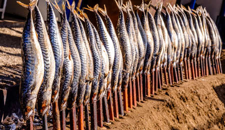 typical bavarian fish on a stick at the oktoberfest - germany