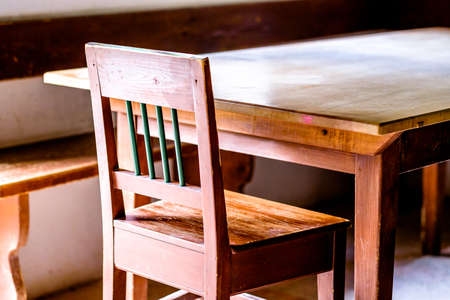 old table and chair at a log cabinの写真素材