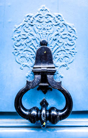 old doorknocker at a doorの写真素材