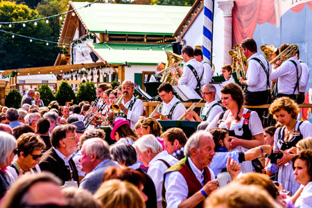 MUNICH, GERMANY - SEPTEMBER 27: brass band musicans at the biggest folk festival in the world - the octoberfest on september 27, 2017 in munich.のeditorial素材